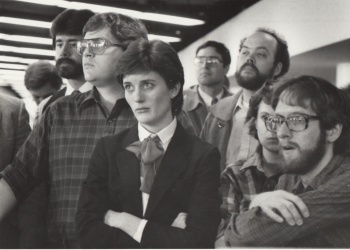 Colleagues at the Des Moines Register and I (in beard and glasses at right) learned in 1985 that the company was being sold to Gannett. That day Rick Tapscott asked Barb Musfeldt who would be someone good at the Register to hire for an opening at the Kansas City Times. She mentioned me.