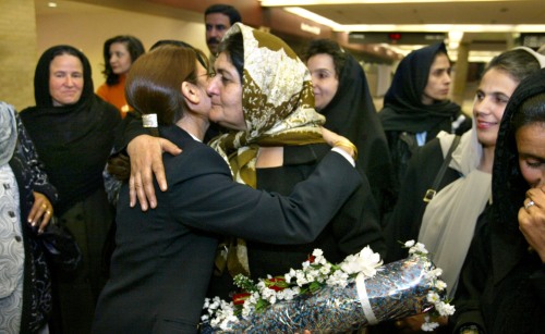 Afghan women arrived in Omaha under the sponsorship of the University of Nebraska at Omaha.  Saleemah, a teacher from Kabul and wearing a scarf is hugged by Masuma Basheer, an employee of America West Airlines in Omaha and a formerly from Afghanistan.  (Omaha World-Herald photo by Bill Batson, used by permission)