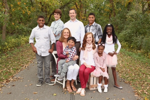 The Poulter family: Standing from left: Denzel, Ethan, Matt, Shay, Maya; sitting, Mandy with Keaton on her lap, Whitley, Chelsea.
